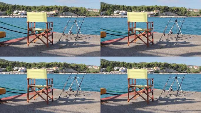码头上空的木制折叠椅，鱼竿很少