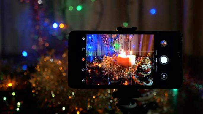 新年的背景，在前台，一个智能手机上录制了一个视频。