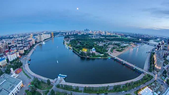 市中心的高架景观，河流和公园以及中央商务区日夜延时，中亚，哈萨克斯坦，阿斯塔纳