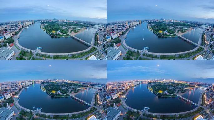 市中心的高架景观，河流和公园以及中央商务区日夜延时，中亚，哈萨克斯坦，阿斯塔纳
