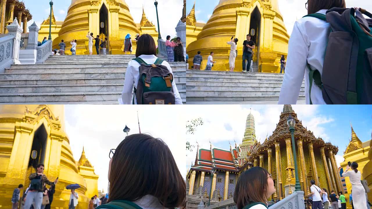 在泰国曼谷大皇宫旅行的年轻女性游客