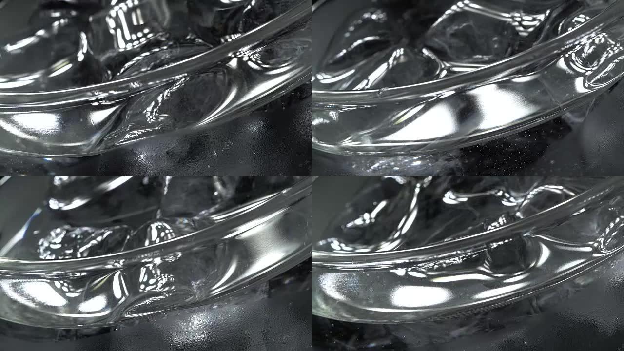 Glass of water with ice in rotation
