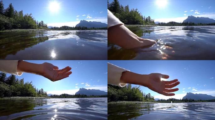 人的手被杯托以从山湖中捕获淡水