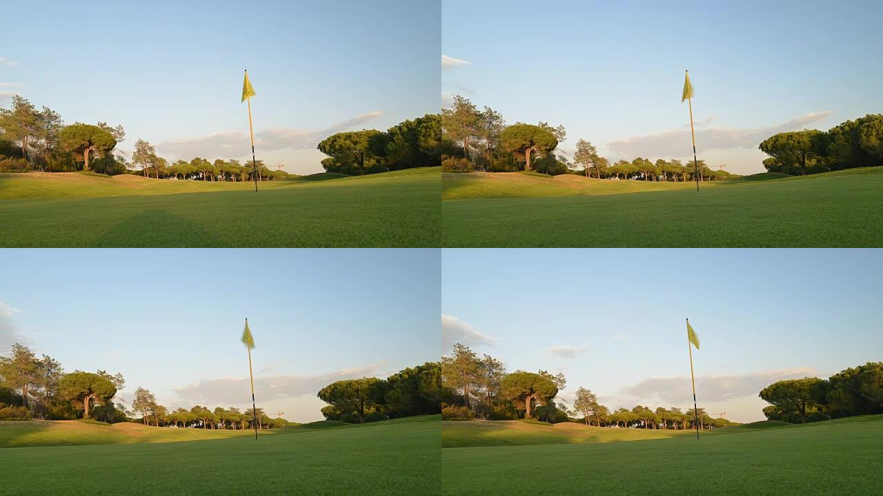 在葡萄牙南部阿尔加维拍摄的高尔夫球场上的绿旗和洞的时间流逝。