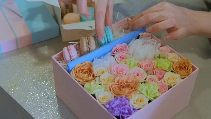 专业花店在花店制作鲜花、蛋糕马卡龙礼品盒