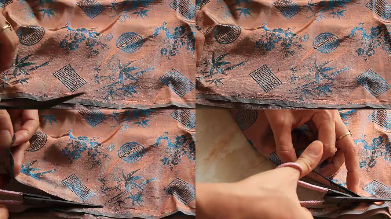 女人用机器缝制衣服