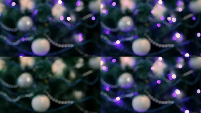 蓝色灯光装饰的圣诞树。未聚焦图像