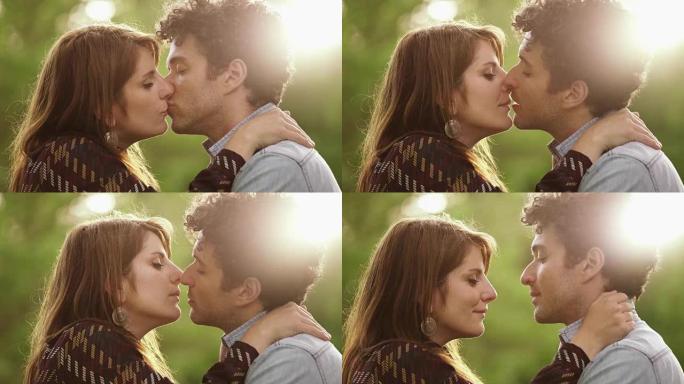 浪漫情侣在夏日公园接吻，特写: 爱情，夏天，浪漫