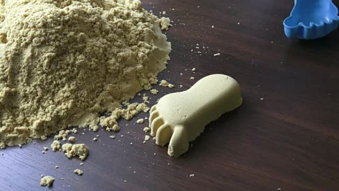 Kinetic sand heap for children. Kinetic sand close