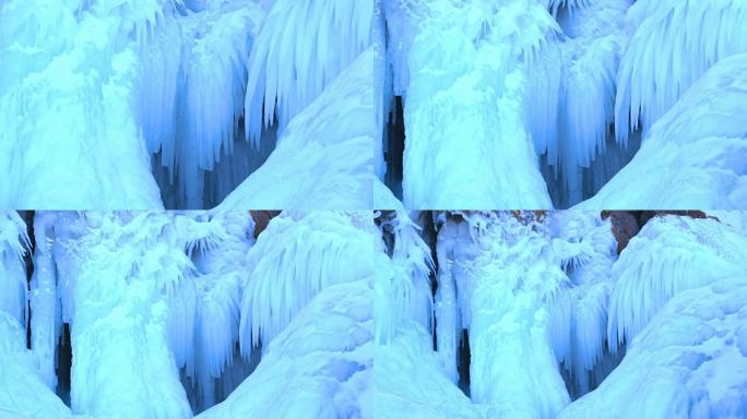 冰柱在冰冻的贝加尔湖的岩石岛上的美丽景色