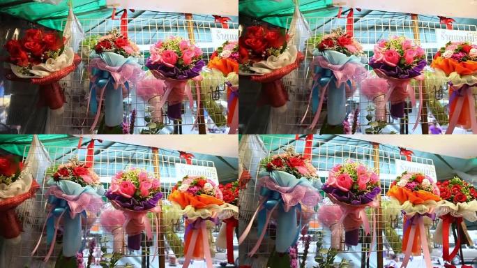 鲜花市场上的花束展示。用彩纸、剑麻和丝带装饰的切割玫瑰。泰国曼谷