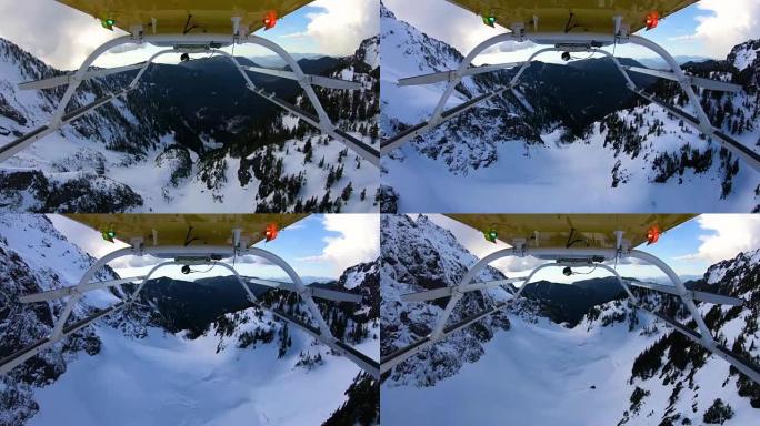 冬季，大胆的旅程探险飞行直升机在冰冻的山峰之间雪山