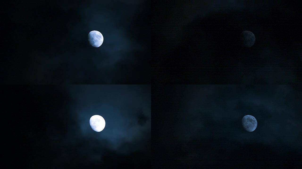 夜晚快速移动的云层后面的满月