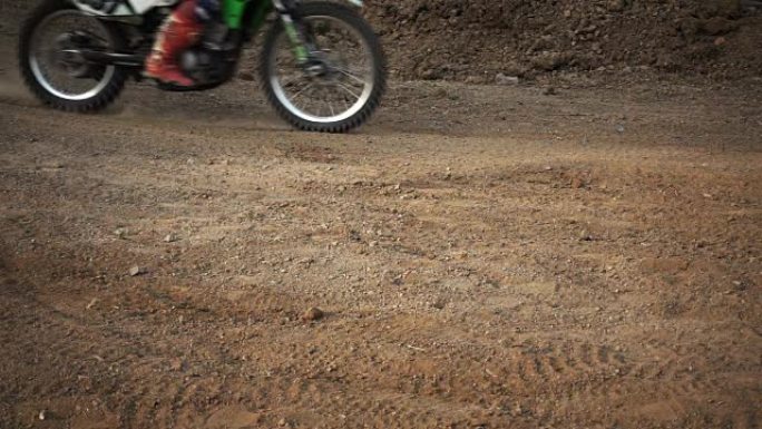 Motocross enduro rider in action accelerating the 