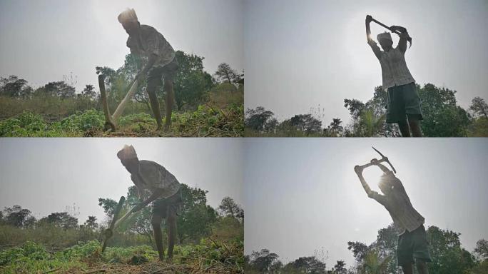 农民用镐挖土的镜头