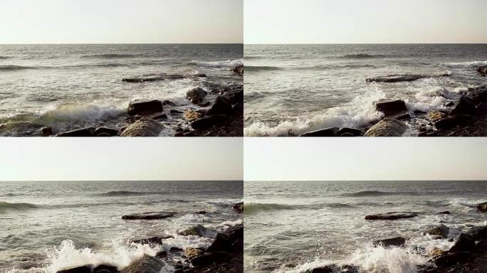 超级缓慢的mo海浪围绕巨石破裂