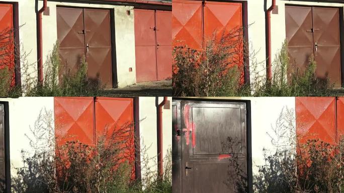 The aged gates of old garages. Old worn abandoned 