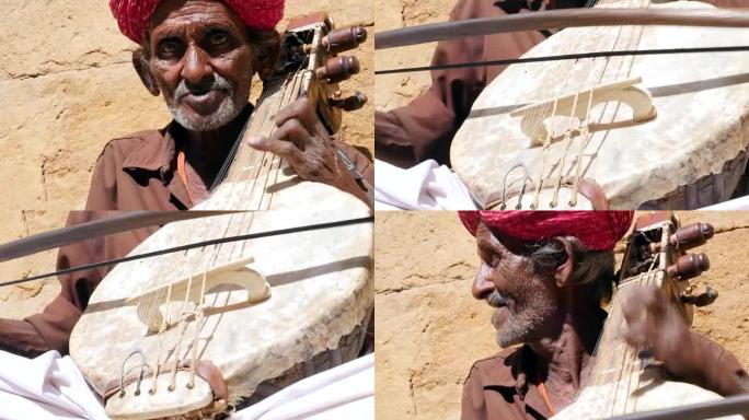 印度老人在印度拉贾斯坦邦Jaisalmer Fort演奏传统乐器