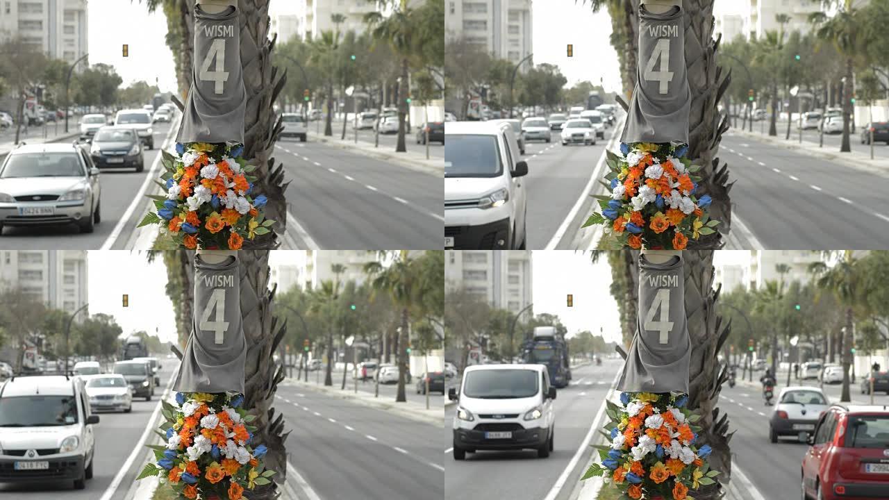 纪念一场交通事故的路灯上的鲜花和衬衫