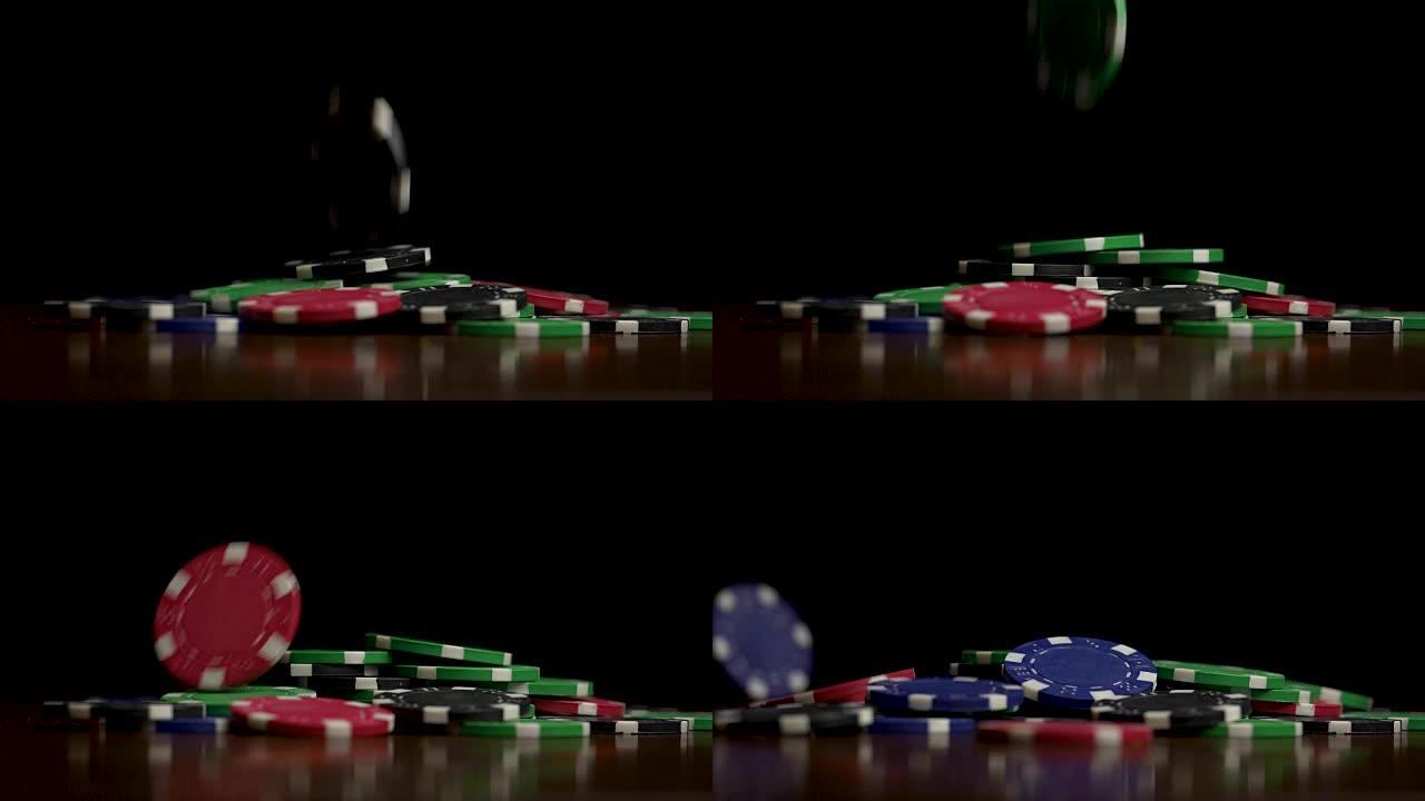 孤注一掷的筹码落在黑色上。在黑色背景的扑克桌上玩筹码飞舞的游戏。薯片在派对背景上飞舞。赌场的概念