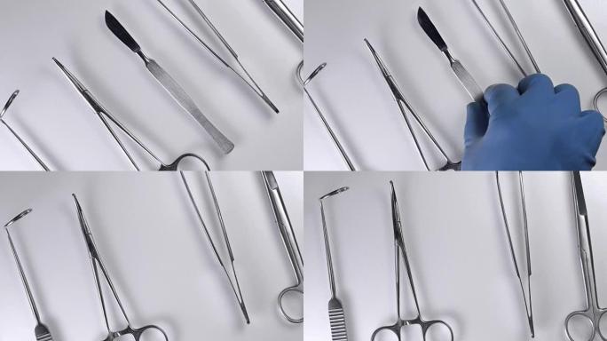 医生用手术器械从桌子上拿手术刀，特写