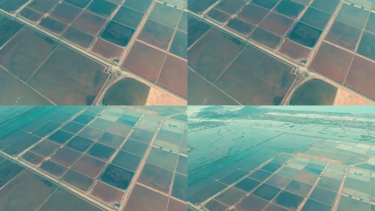 Hon Khoi盐场鸟瞰图，位于芽庄，在那里从越南Doc Let海滩的浅水区人工收获天然盐堆