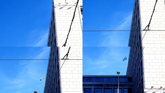 跟踪拍摄在立面上，粮农组织的旗帜在蓝天上挥舞