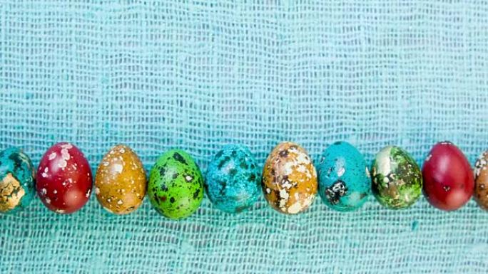 彩色美丽的复活节彩蛋排成一排。