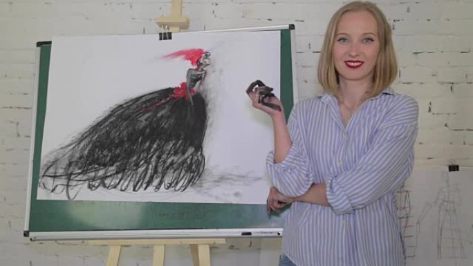 女艺术家用木炭在画布上画了一个黑色连衣裙的女人。画布立在画架上。图纸完成