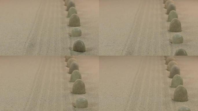 白色石头站在沙子上的近似。多莉