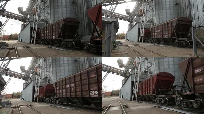 货运列车与农作物作为货物运输在海上大谷物码头移动。将谷物从铁路车厢卸载到电梯。谷物转运设施枢纽筒仓