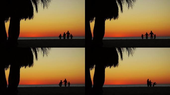 在海边休息。浪漫的日落。一家人沿着海边奔跑。在舞蹈中盘旋的所有乐趣