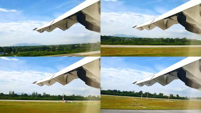 从机翼和发动机上起飞后从飞机窗户看到的景色。飞机在运输或旅行概念上飞越云层和天空。
