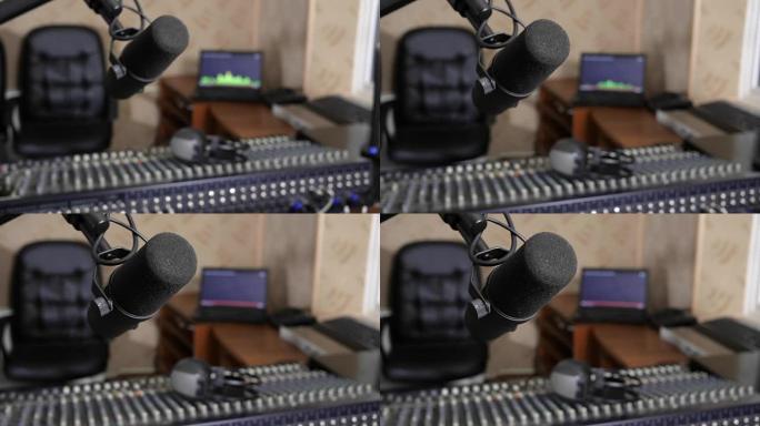电台上有很多技术，专业麦克风和音频控制台的特写镜头