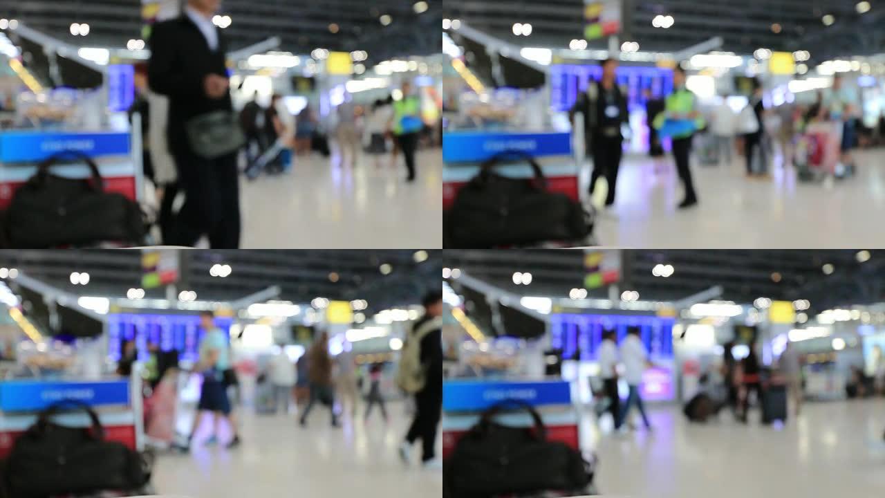 摘要模糊了通勤人群和乘客在机场航站楼行走的视线，模糊了繁忙的机场航站楼镜头的概念。