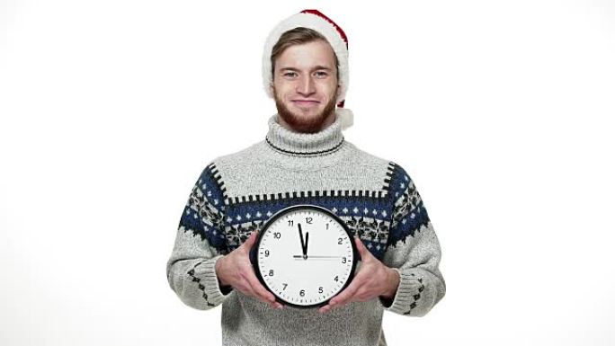 Slow motion handsome man in sweater holding clock 