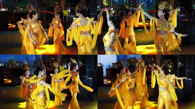 穿着泰国传统黄色服装跳舞的五名亚洲女性女演员