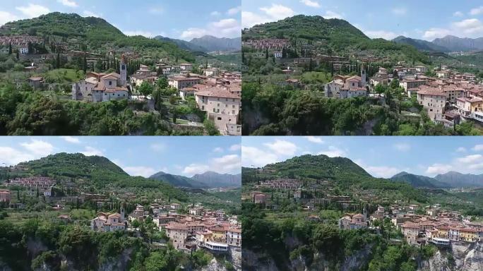 意大利。山上的教堂和老城区。美丽的加尔达湖被群山环绕的全景。无人机视频拍摄