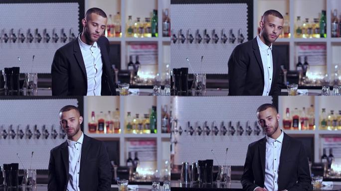 一名年轻迷人的非洲裔美国男子在酒吧茫然地盯着相机的肖像照片