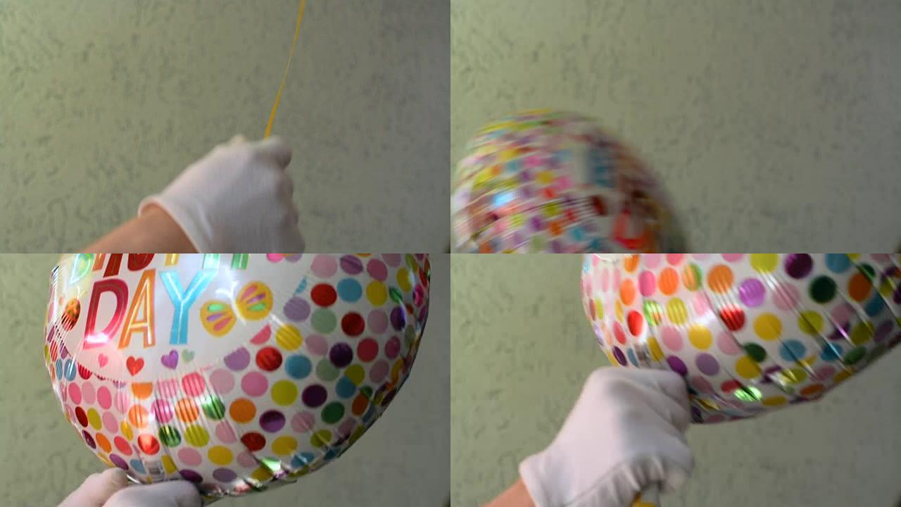 戴着白手套的小丑正在赠送一个hapy生日聚会庆祝气球