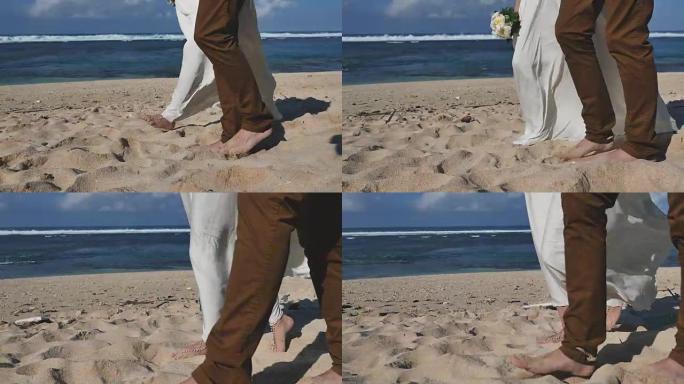 新婚夫妇刚结婚并在海滩散步的镜头
