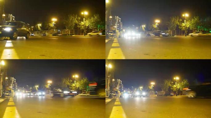 城市的夜间交通。汽车在夜间道路上开灯行驶。时间流逝