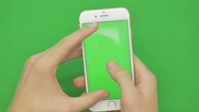 在绿屏上使用智能手机，各种手势，vertikal，特写-绿屏