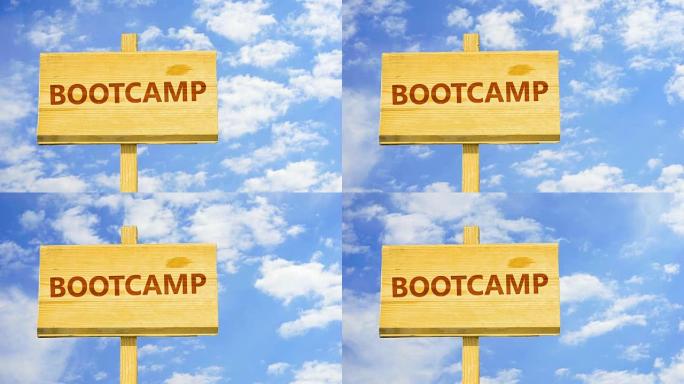 木制标志上的Bootcamp单词，以对抗蓝天中的延时云彩。