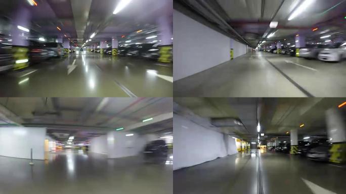 Pov开车穿过城市的地下停车场，实时。汽车进入停车场。地下停车场可以在购物中心、酒店、住宅楼、出租汽