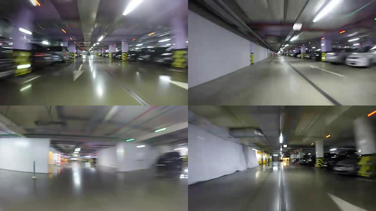 Pov开车穿过城市的地下停车场，实时。汽车进入停车场。地下停车场可以在购物中心、酒店、住宅楼、出租汽
