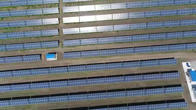 太阳能发电厂的全景，成排的太阳能电池板，太阳能电池板，俯视图，太阳能发电厂的鸟瞰图，可再生资源主题的