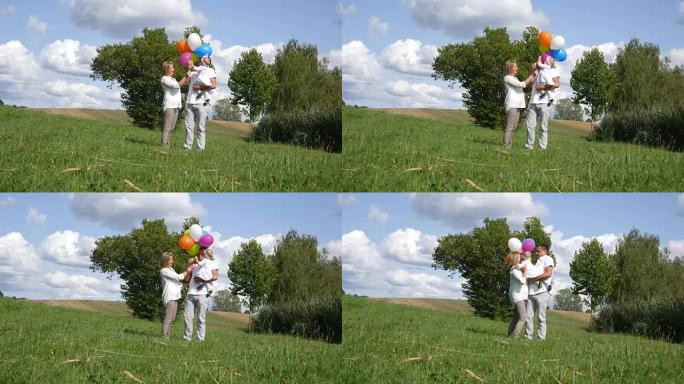 家庭在草坪上发射气球