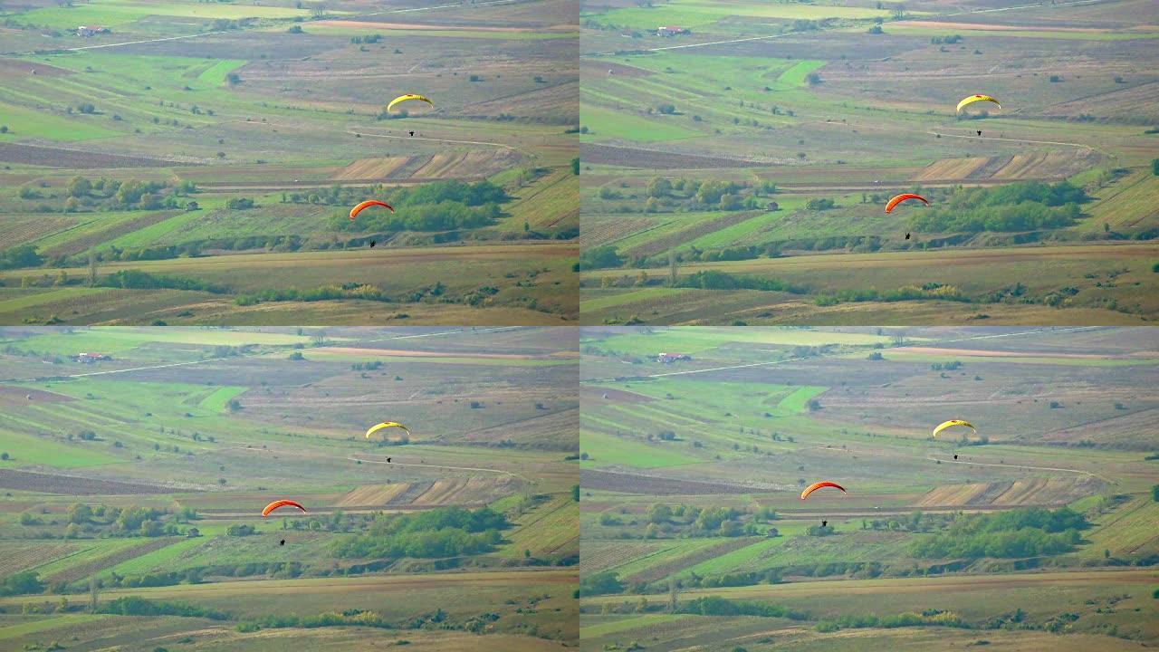 滑翔伞在绿色景观上滑翔伞