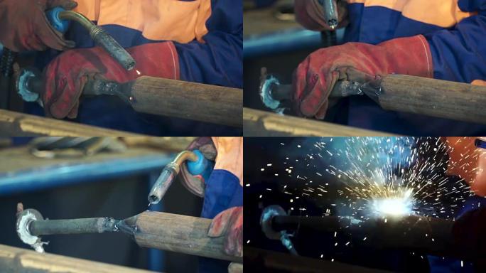 工业工人在工厂焊接特写。工厂钢结构电动轮磨削。焊接工作